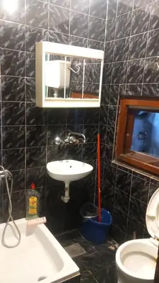 a bathroom with a sink and a toilet at Nina Lili in Mirijevo