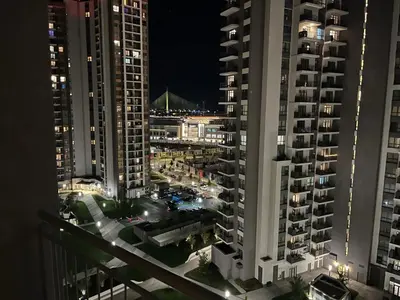 a view of a city at night with tall buildings at Aurora 011 in Sajmište