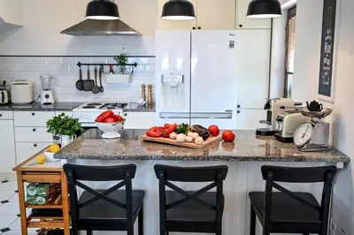 a kitchen with a counter with a tray of vegetables on it at Glamping Home in Bukovik
