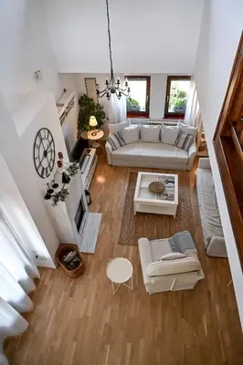 a living room with a couch and a table at Glamping Home in Bukovik
