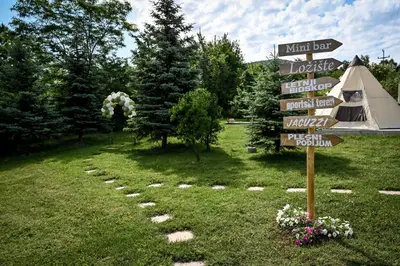 a street sign in a field with a tent at Glamping Home in Bukovik