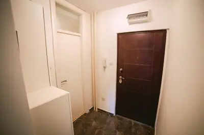 a small room with a door and a hallway at Lina Apartments in Belgrade