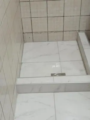 a white tiled shower with a toilet in a bathroom at Beograd, Oaza Palilula, 2 in Borča