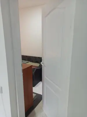 a room with a white door and a desk at Beograd, Oaza Palilula, 2 in Borča