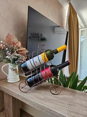 a bunch of wine bottles on a table at Apartman Gaga in Batajnica