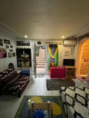 a living room with a couch and a table at Jakovljević Apartment in Belgrade