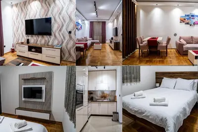 a hotel room with a bed and a living room at Apartman ISKRA - Velvet in Arandjelovac