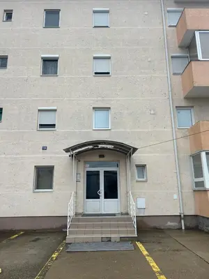 a building with a door and stairs in front at Dream apartmen in Novi Grad