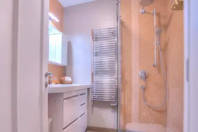 a bathroom with a shower and a sink at Peaceful Downtown Home in Vračar (historical)