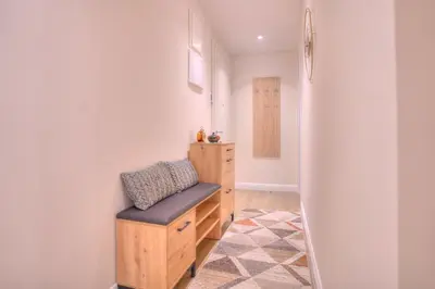 a dressing room with a bench in a room at Peaceful Downtown Home in Vračar (historical)