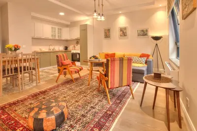 a living room with a couch and a table at Peaceful Downtown Home in Vračar (historical)
