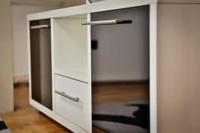 a white cabinet with two drawers and a door at Malisic apartmani Vračar in Vračar (historical)