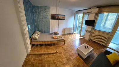 a living room with a couch and a table at Blok 1 in Belgrade