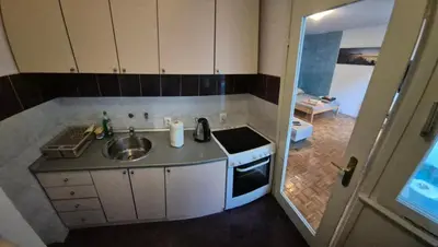 a small kitchen with a sink and a stove at Blok 1 in Belgrade