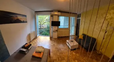 a living room with a couch and a television at Blok 1 in Belgrade