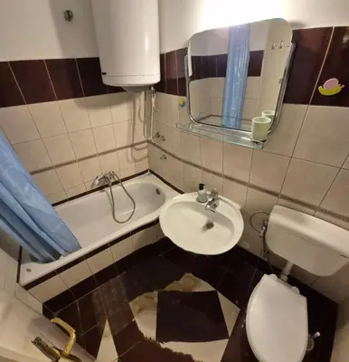 a bathroom with a sink and a toilet and a mirror at Blok 1 in Belgrade