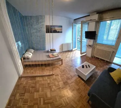 a living room with a couch and a table at Blok 1 in Belgrade