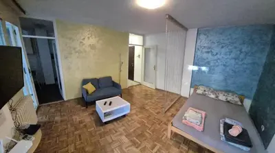 a living room with a couch and a table at Blok 1 in Belgrade