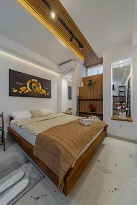 a bedroom with a large bed in a room at Keti Zemun Spa Apartment in Zemun