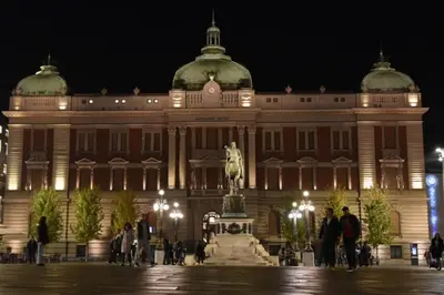 a large building with a statue in front of it at Completely new, Bonbona Apartment Belgrade in Belgrade