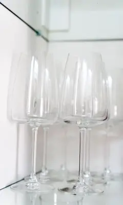 a group of wine glasses sitting on a counter at Completely new, Bonbona Apartment Belgrade in Belgrade