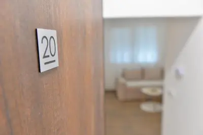 a close up of a door with the number on it at Andjela Apartments in Inđija