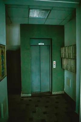 an empty hallway with a door in a building at Apartment Stela in Belgrade