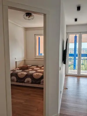 a bedroom with a bed and a window at Andrej 64 in Bežanija