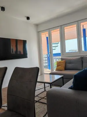 a living room with a couch and a table at Andrej 64 in Bežanija