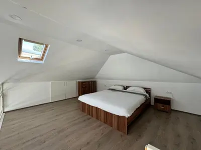 a bedroom with a bed in a attic at Beautiful houseboat on the Sava river in Belgrade
