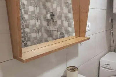 a glass shower in a bathroom with a toilet at Airport Studio Stefan in Belgrade