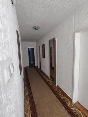 an empty hallway of a building with a hallway at STD Havela in Kovačica