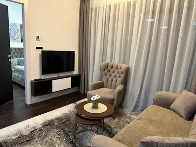 a living room with a couch and a tv at Suzi in Belgrade
