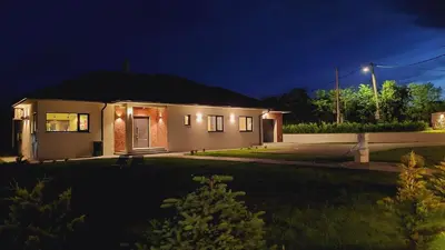 a small house at night with a street light at Kosmaj IKIGAI in Nemenikuće