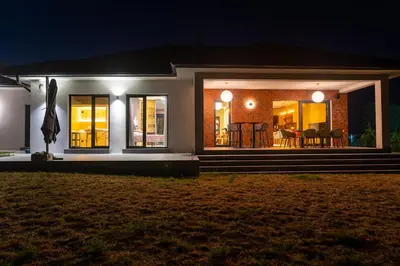 a house at night with the lights on at Kosmaj IKIGAI in Nemenikuće
