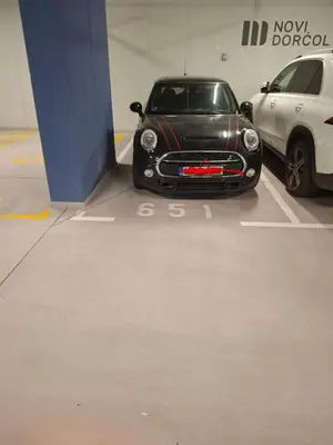 a small black car parked in a garage at City Center - The Port Apartment with Terrace & Garage in Belgrade