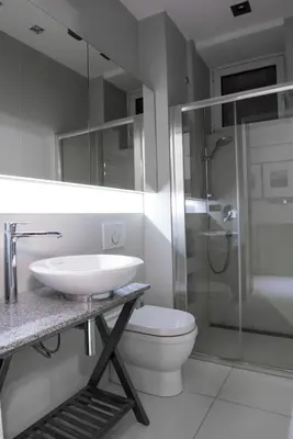 a bathroom with a sink and a toilet and a shower at Apartment Silicon Valley in Belgrade