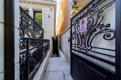 a black door with a no parking sign on it at Kovac Spa Belgrade Apartment in Belgrade