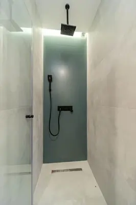 a bathroom with a shower with a hose at Kovac Spa Belgrade Apartment in Belgrade