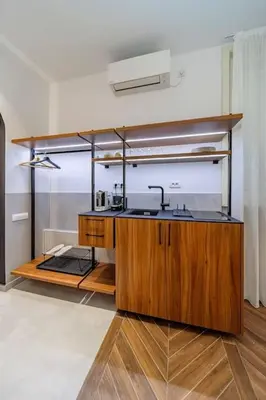 a kitchen with a sink in a room at Kovac Spa Belgrade Apartment in Belgrade