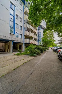 an empty street in front of a building at Ritual Belgrade Apartment in Belgrade