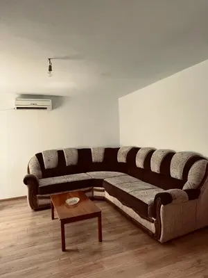 a living room with a large couch and a coffee table at Stan na dan in Belgrade