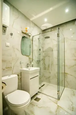 a bathroom with a toilet and a glass shower at Aleksa&Una in Ledine