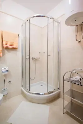 a shower with a glass enclosure in a bathroom at Apartments King Milan, City Center in Belgrade