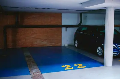 a parking garage with a car parked in it at Viktorija Apartment in Belgrade