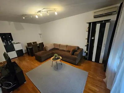 a living room with a couch and a table at Star Belville in Novi Beograd