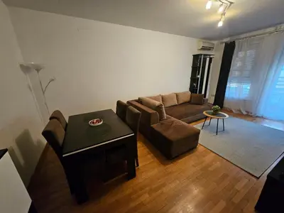 a living room with a couch and a table at Star Belville in Novi Beograd