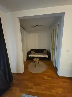 a room with a bed and a table in it at Star Belville in Novi Beograd
