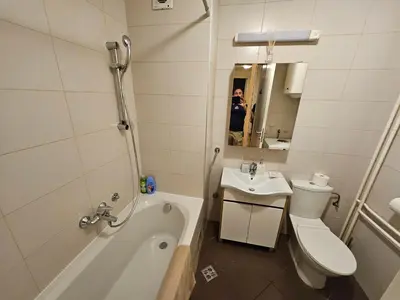 a bathroom with a sink and a toilet and a tub at Star Belville in Novi Beograd