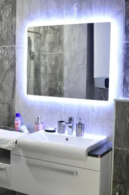 a bathroom with a white sink and a mirror at New Moment Lux 2 in Žarkovo